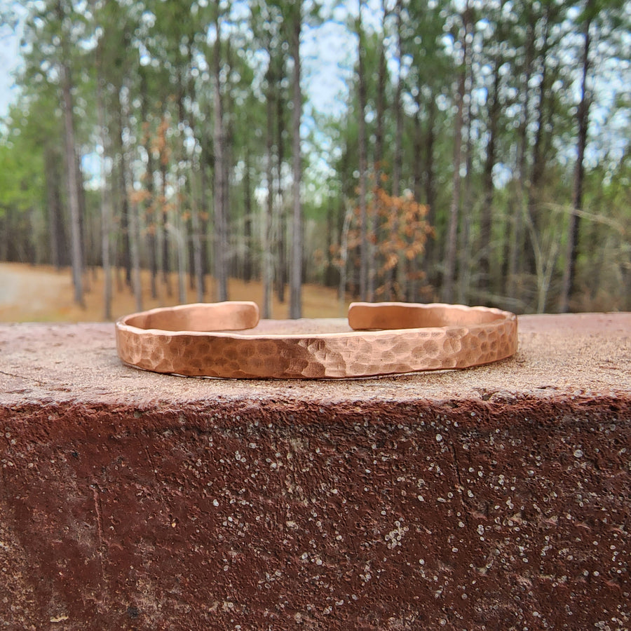 closeup of full hand hammered copper cuff bracelet for men. Truly Hand Made in Louisiana USA. 