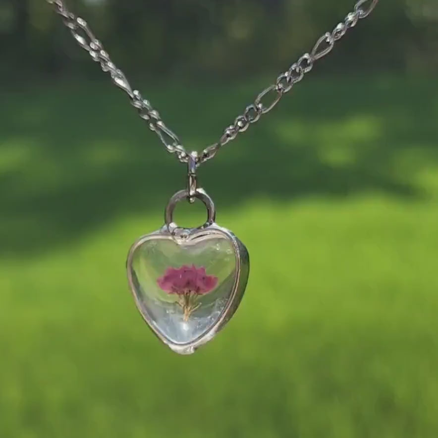 video of small dainty pressed flower heart pendant charm small scottish heather necklace