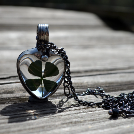 Four leaf clover shamrock in glass heart pendant necklace. Good luck charm for St Pattys Day or March Birthday or any day.Truly Hand Made in USA by Louisiana Artisan at Bayou Glass Arts Studio. Chain is quality plated fully adjustable Figaro style. All are 100% handmade from metals that contain NO lead, cadmium, zinc or nickel. 