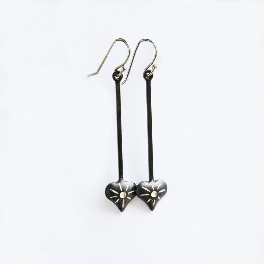 set of dangle heart starburst earrings truly hand made in USA by Louisiana Artisans at Bayou Glass Arts Studio. Sterling Silver ear wires