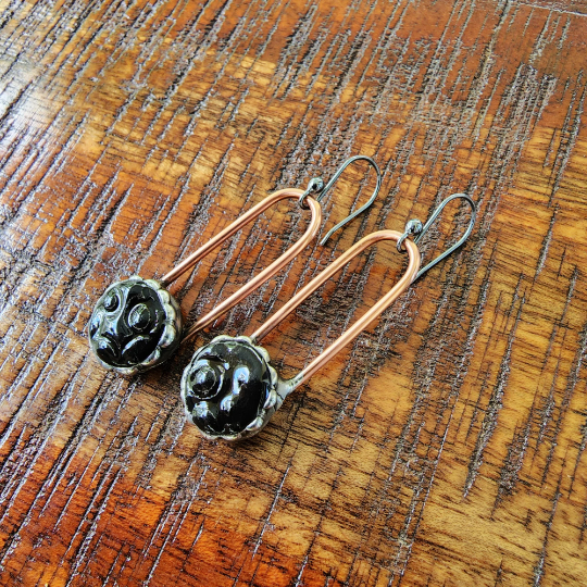 black ceramic dot earrings on copper wires, dangle earrings attached to sterling silver ear wires. Truly Hand Made In USA by Louisiana Artisan at Bayou Glass Arts Studio.