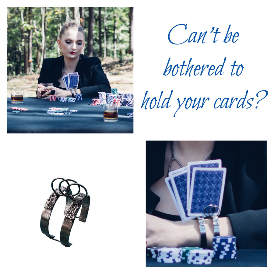 Model playing cards and holding her cards in her one of a kind bracelet from Bayou Glass Arts. Metal bracelet cuff with rounded wires that will hold your cards upright.