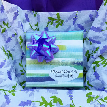 Gift Wrapping by Bayou Glass Arts. Lavender and Green/Blue high quality wrapping paper with coordinated bow. Then wrapped in designer tissue paper before it goes in the shipping box. No charge to add a Gift message.