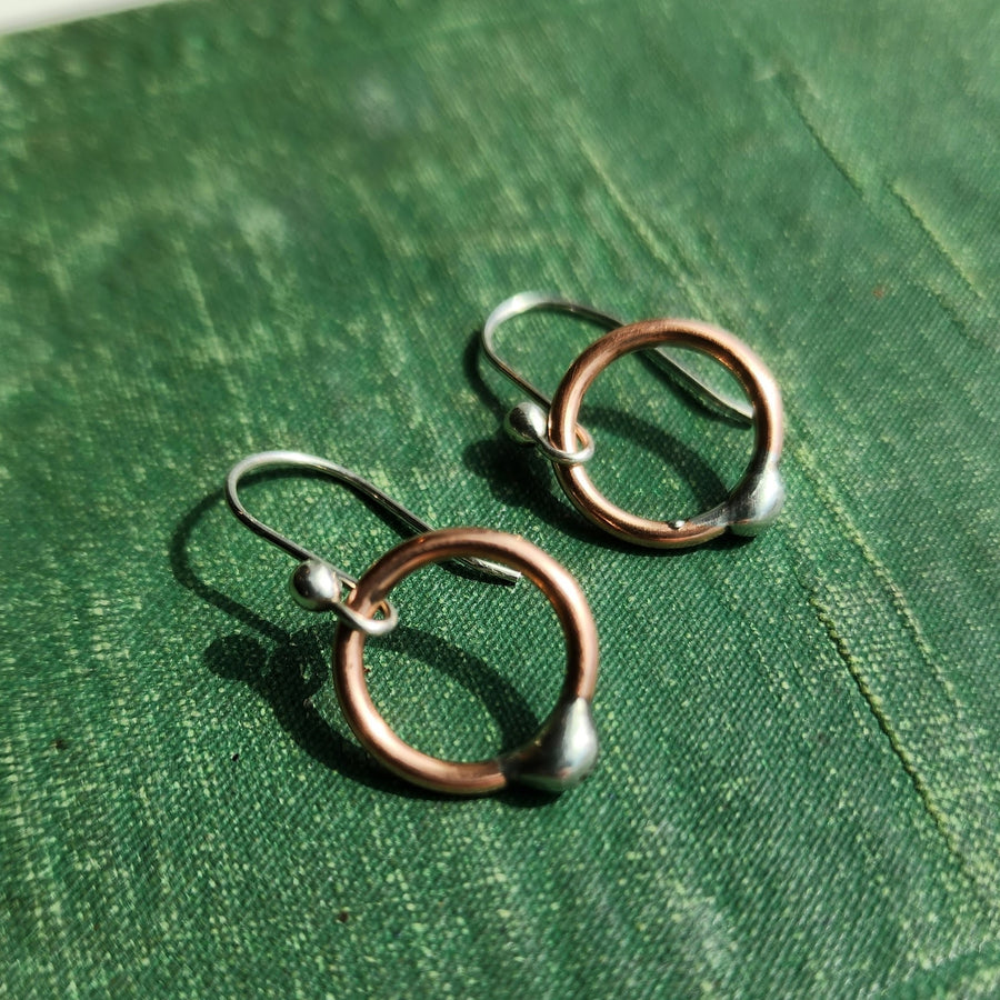 Handmade small copper open hoop earrings with .925 Sterling silver ear wires. Truly hand made in USA by Louisiana artisan at Bayou Glass Arts studio.