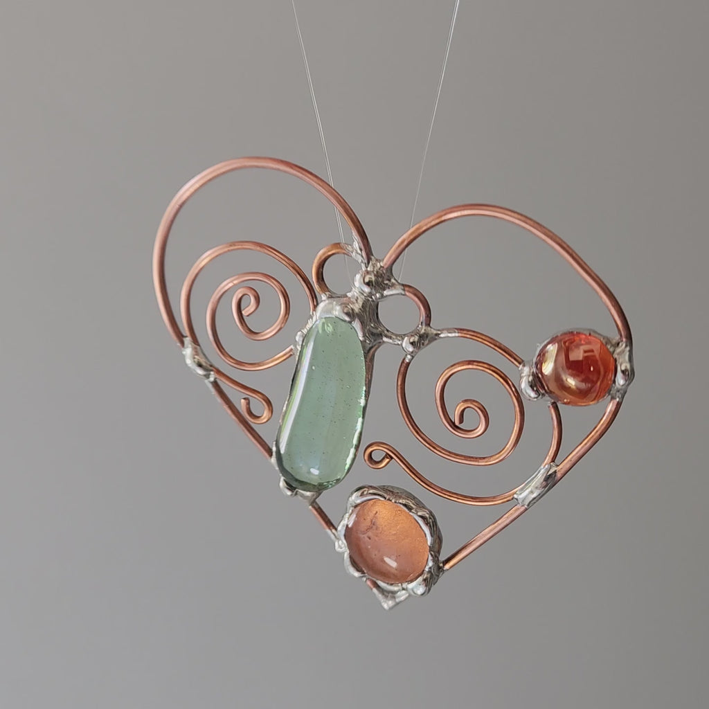 Video of artisan sun catcher hand made in USA by Louisiana artisans at Bayou Glass Arts studio. 