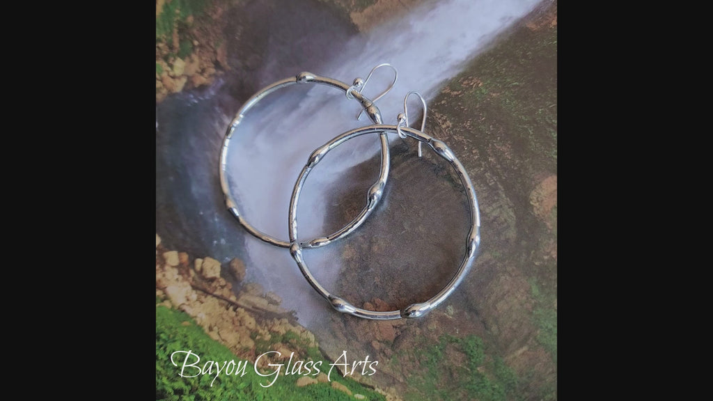 Video Showing Large Silver on Silver Finish Hoop Earrings with Sterling Silver Ear Wires. Truly Hand Made in USA by Louisiana Artisan at Bayou Glass Arts Studio.