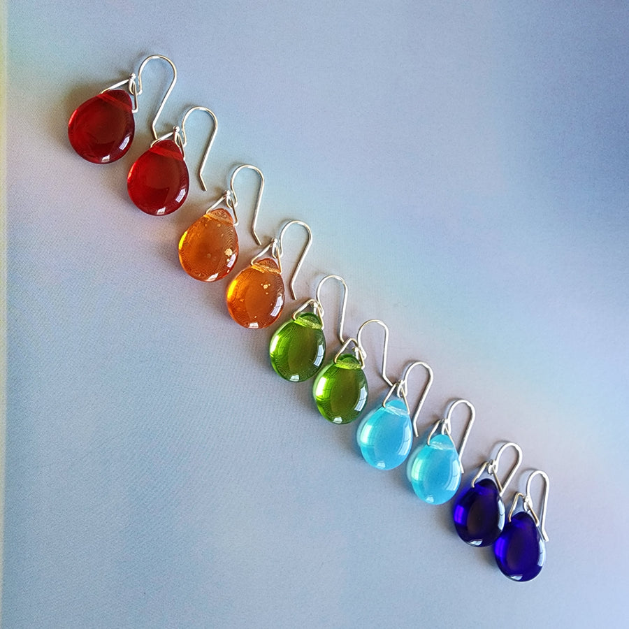 5 pairs ofHandmade Glass Drop Earrings with Hand formed Sterling Silver Ear Wires and findings in a rainbow of colors. Red, Orange, Green, Aqua and Blue.Truly Hand Made in USA by Louisiana Artisan at Bayou Glass Arts Studio.
