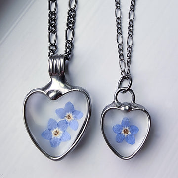 Forget me not heart pendants, one large with 2 blooms and one dainty with one bloom. Bezel is hand formed with copper and mixed silver solder by Louisiana Artisan. Hand made in USA. Mother daughter gift for mothers day.