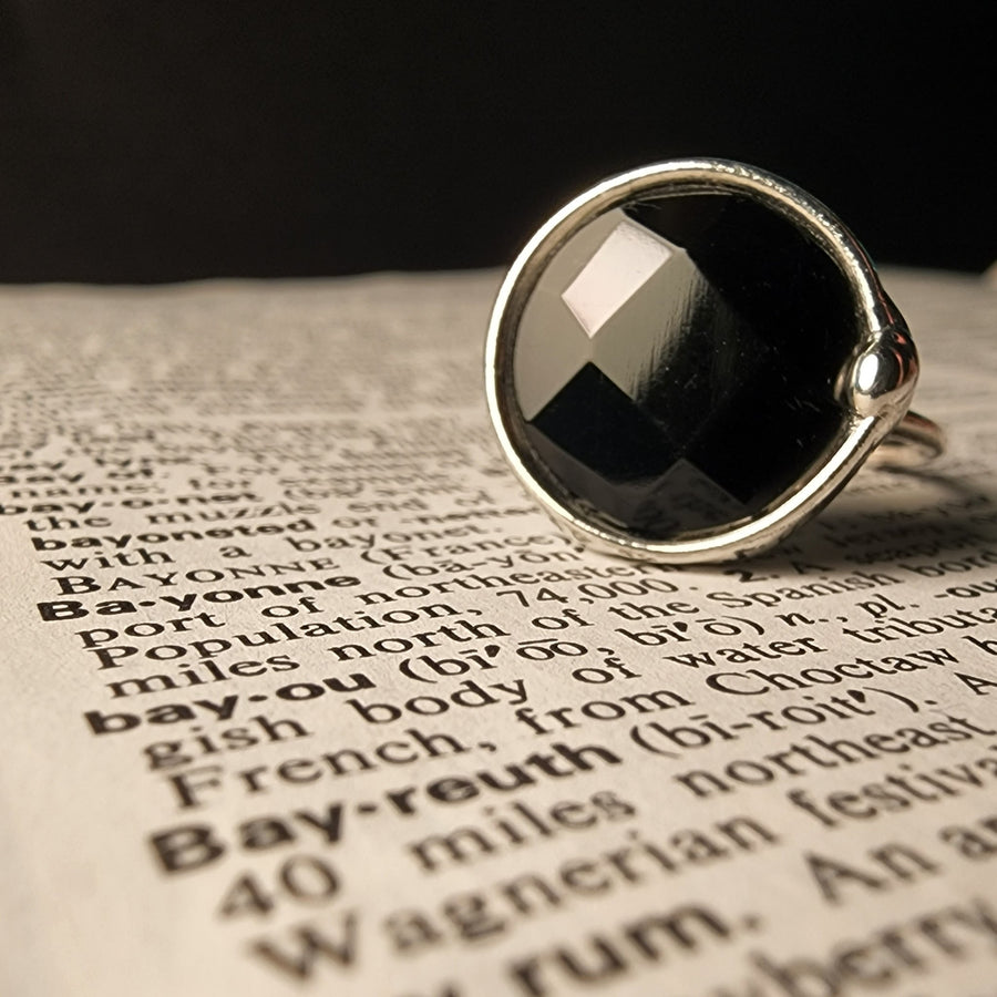 Hand Crafted Black Glass Faceted Ring on adjustable Sterling Silver Band. Hand made in USA by Louisiana Artisan at Bayou Glass Arts Studio.