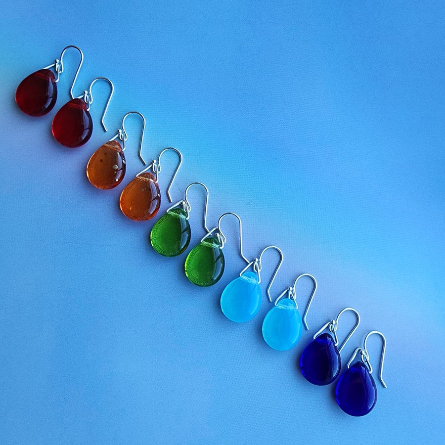 Skittle earrings in orange red green aqua and blue with sterling silver components and ear wires. Truly Hand Made in USA by Louisiana Artisan at Bayou Glass Arts studio.