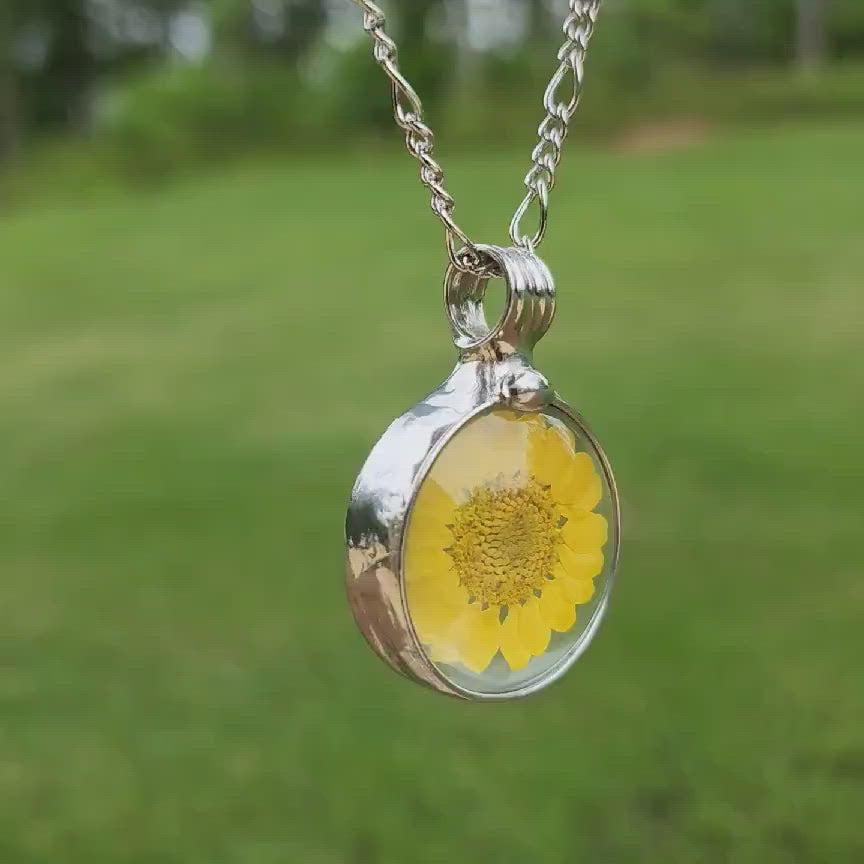 video of yellow sunflower pendant with shiny silver finish. Truly Hand Made in USA by Louisiana Artisans at Bayou Glass Arts. 