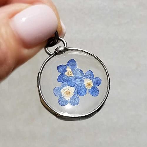 Handmade Pressed Flower Forget Me Not Pendant Necklace. 3 Blue Blooms grace this delicate pendant that is round and comes in gunmetal or shiny silver finish. Perfect gift for 3 sisters, BFF's, triplets, Mom and daughters. All Jewelry is Hand Made in USA by Louisiana Artisan at Bayou Glass Arts Studio.