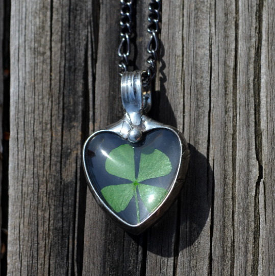 4 leaf clover in glass heart pendant necklace for women.Truly Hand Made in USA by Louisiana Artisan at Bayou Glass Arts Studio. Chain is quality plated fully adjustable Figaro style. All are 100% handmade from metals that contain NO lead, cadmium, zinc or nickel. 