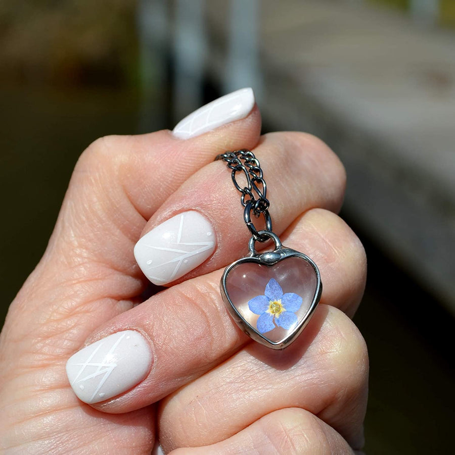 Tiny Glass Heart Pendant Charm with Blue Real Forget Me Not. Real Pressed Flower Jewelry Hand Made by Artisan at Bayou Glass Arts in the Louisiana Bayou USA