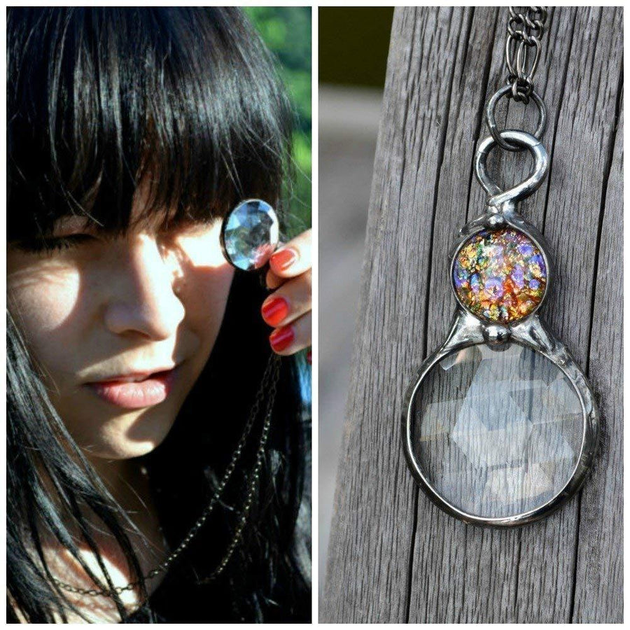 Model peeking through Handmade Kaleidoscope Pendant Necklace with multicolored opal inset. Jewelry Designed and Created in USA