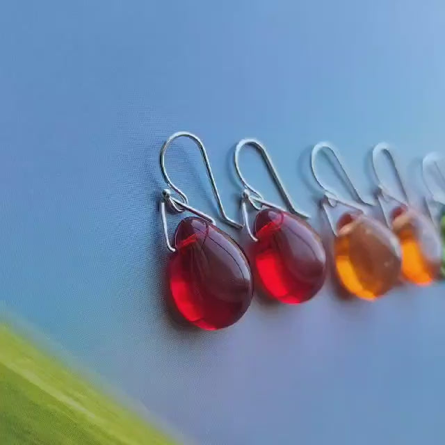Skittle earrings in orange red green aqua and blue with sterling silver components and ear wires. Truly Hand Made in USA by Louisiana Artisan at Bayou Glass Arts studio.