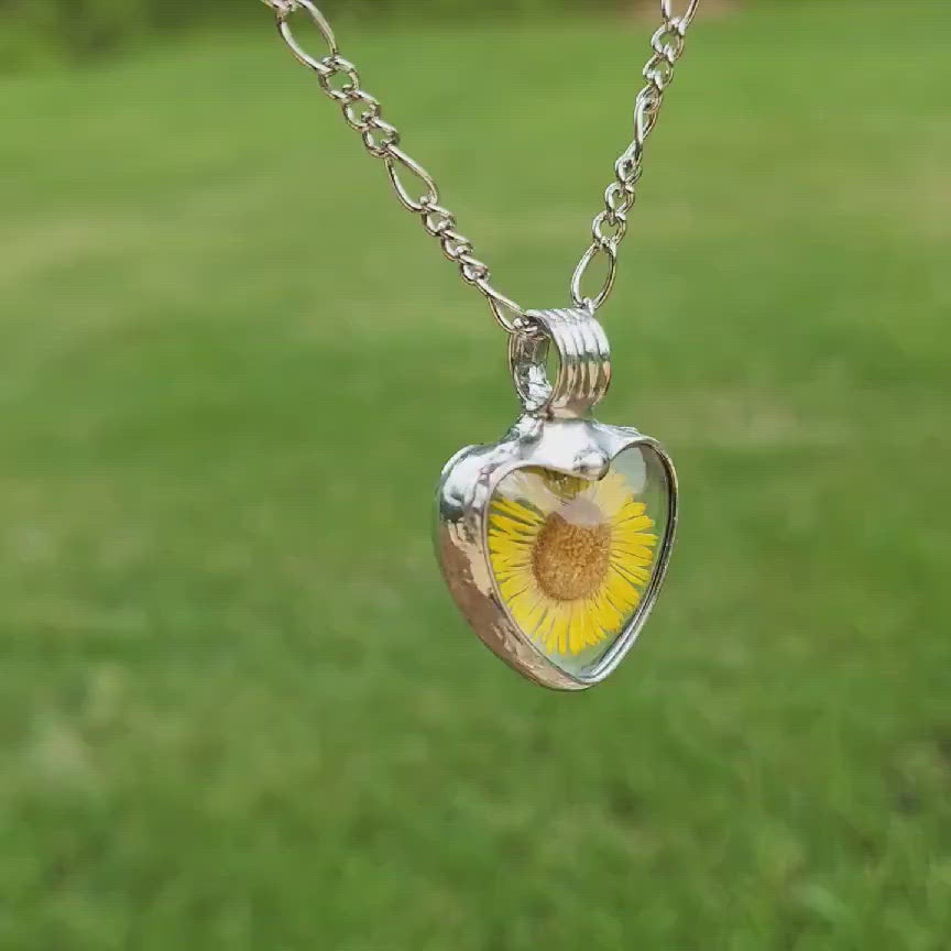 Real Pressed Flower in Glass Heart Pendant. Bright Yellow Sunflower in Shiny Silver Finish and chain. Truly Hand Made in USA by Artisans at Bayou Glass Arts in Louisiana. 
