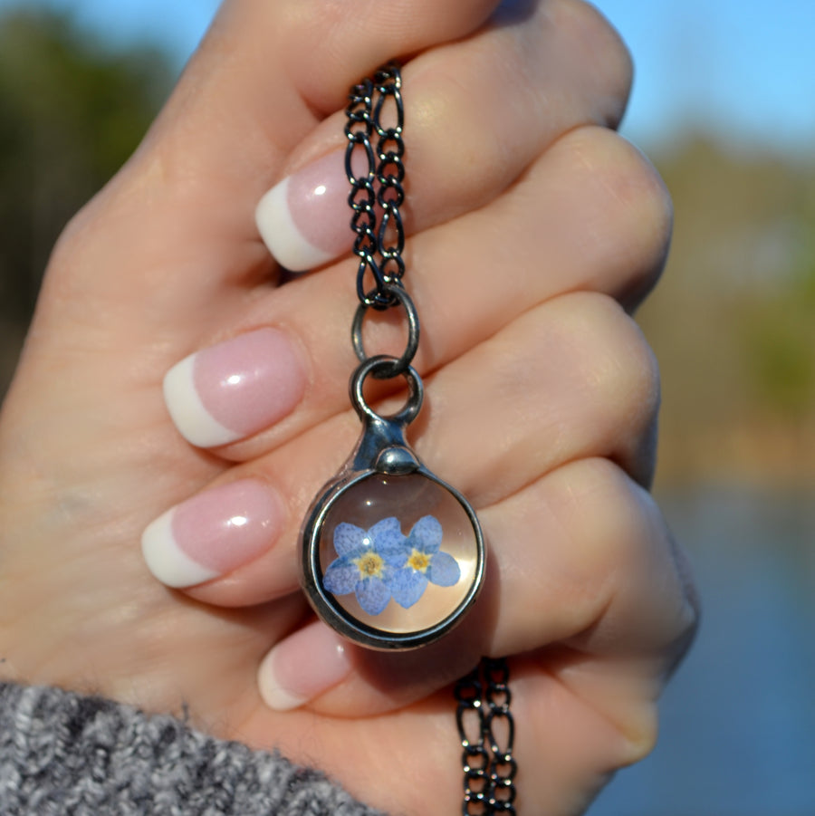  Handmade Real Dry Pressed Flower forget me not charm pendant necklace with 2 blooms inside. Truly Hand Made in USA by Louisiana Artisan at Bayou Glass Arts Studio.