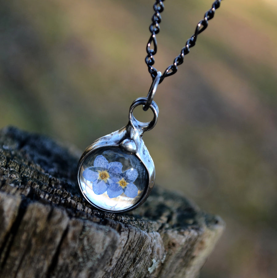  Handmade Real Dry Pressed Flower forget me not charm pendant necklace with 2 blooms inside. Truly Hand Made in USA by Louisiana Artisan at Bayou Glass Arts Studio.