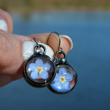 Handmade Real Dry Pressed Flower forget me not earrings, hand formed oxidized sterling silver ear wires. Truly Hand Made in USA by Louisiana Artisan at Bayou Glass Arts Studio. 