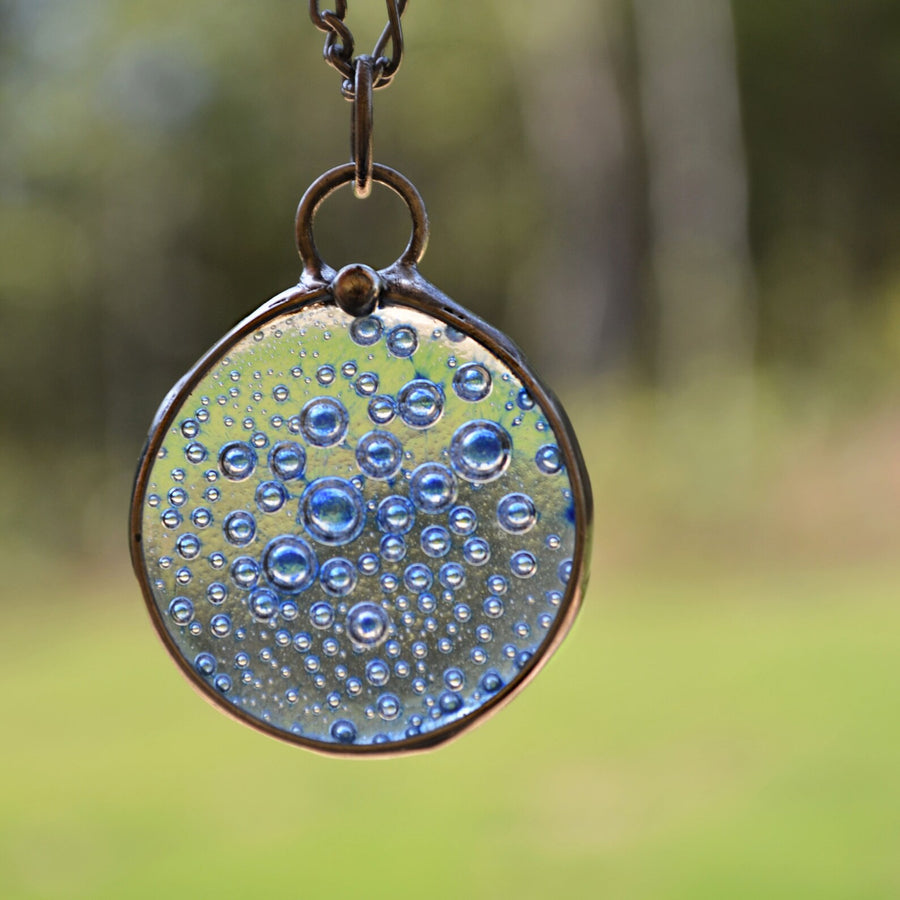 Blue bubbles fused in large round glass pendant. Handmade in USA by Louisiana Artisan at Bayou Glass Arts Studio.