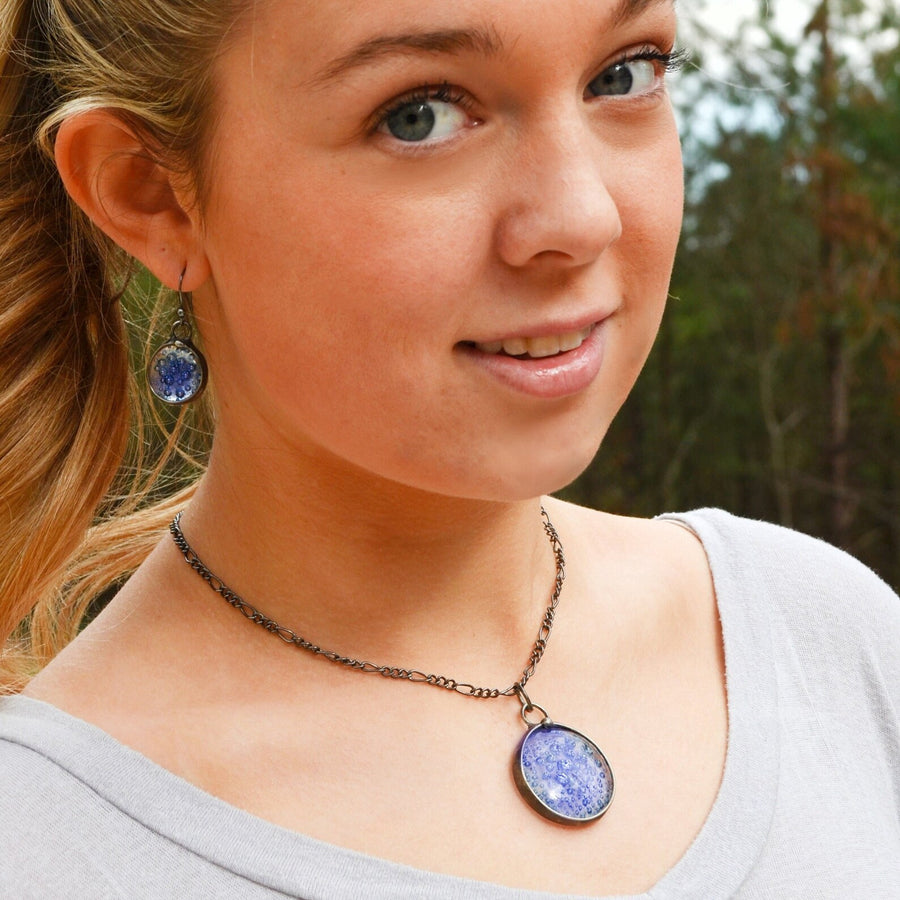 Model wearing Blue Bubble Dot Pendant Necklace and matching earrings with Sterling Silver ear Wires. 