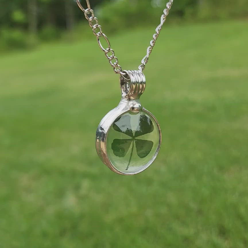 Video of shiny silver finish on 4 leafed clover pendant. Hand Made In USA by Artisans at Bayou Glass Arts in Louisiana. Truly not manufactured