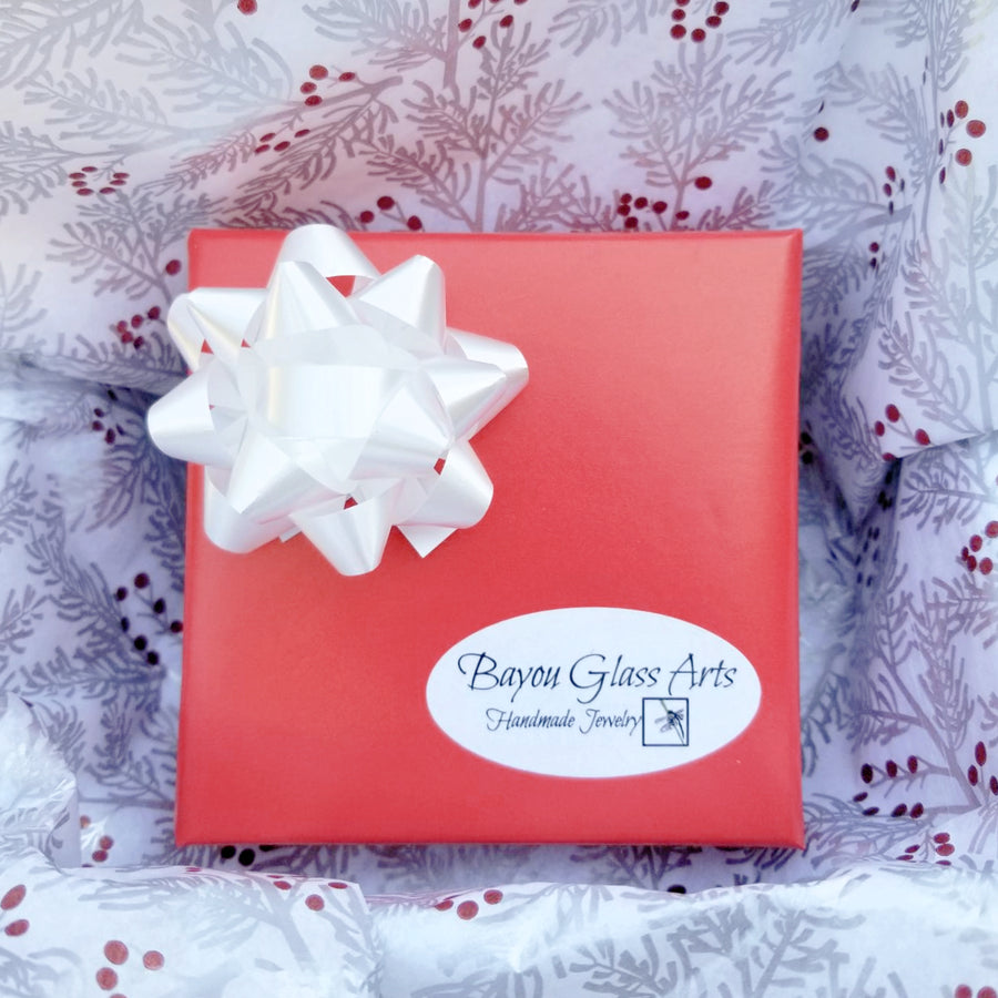Christmas Holiday Gift Wrapping by Bayou Glass Arts.  High quality red wrapping paper with coordinated bow. Then wrapped in designer tissue paper before it goes in the shipping box. No charge to add a Gift message.