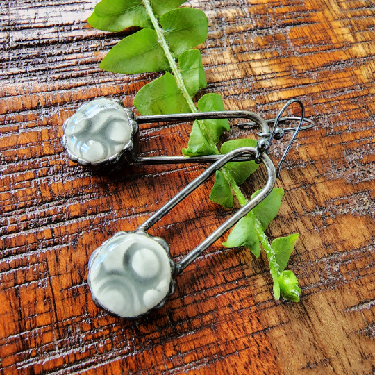 grey ceramic dot earrings on copper wires, dangle earrings attached to sterling silver ear wires. Truly Hand Made In USA by Louisiana Artisan at Bayou Glass Arts Studio.