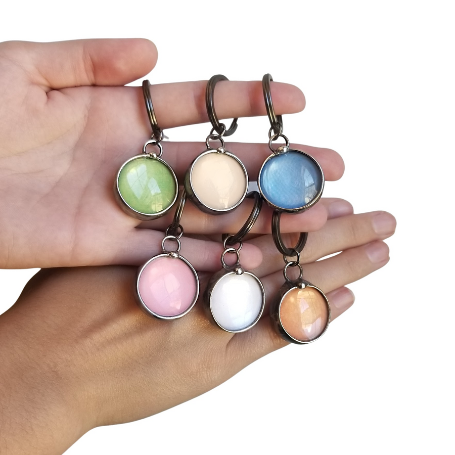 6 See See Hidden Message Pendant Key Chains. Green, Peach, Blue, Pink, White, Orange.See See Jewelry is hand made in USA by Louisiana Artisan at Bayou Glass Arts Studio. Secret message hidden inside is revealed when pendant is held up to a light.
