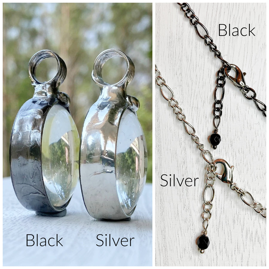 2 images of Bayou Glass Arts jewelry to show the differences in the 2 finishes that we offer. Gunmetal/shiny black and shiny silver. 