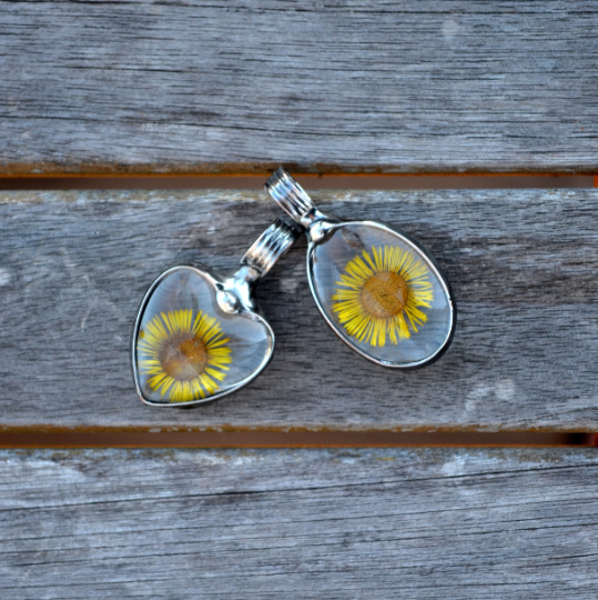 2 Yellow Aster pendants, a heart and an oval. Side by side for comparison. Truly Hand Made in USA by Artisans at Bayou Glass Arts in Louisiana. 