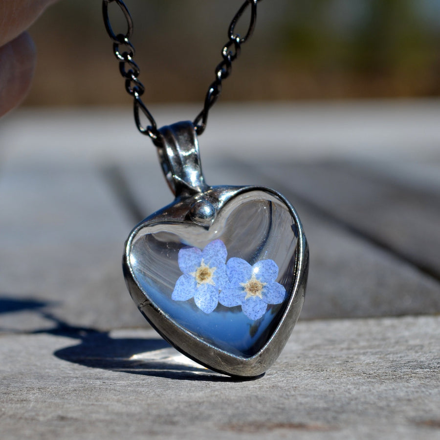 Forget me not heart pendant with 2 pressed flower blooms.Bezel is hand formed with copper and mixed silver solder by Louisiana Artisan. Hand made in USA. Mother daughter gift for mothers day.