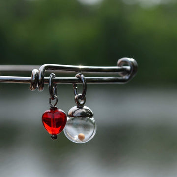 red_glass_heart_with_mustard_seed_round_on_adjustable_bracelet