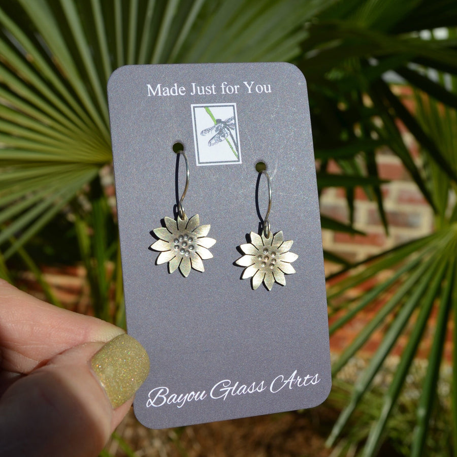 hand hammered and cut sterling silver sunflower earrings. Truly hand made in USA by Louisiana Artisan at Bayou Glass Arts studio.