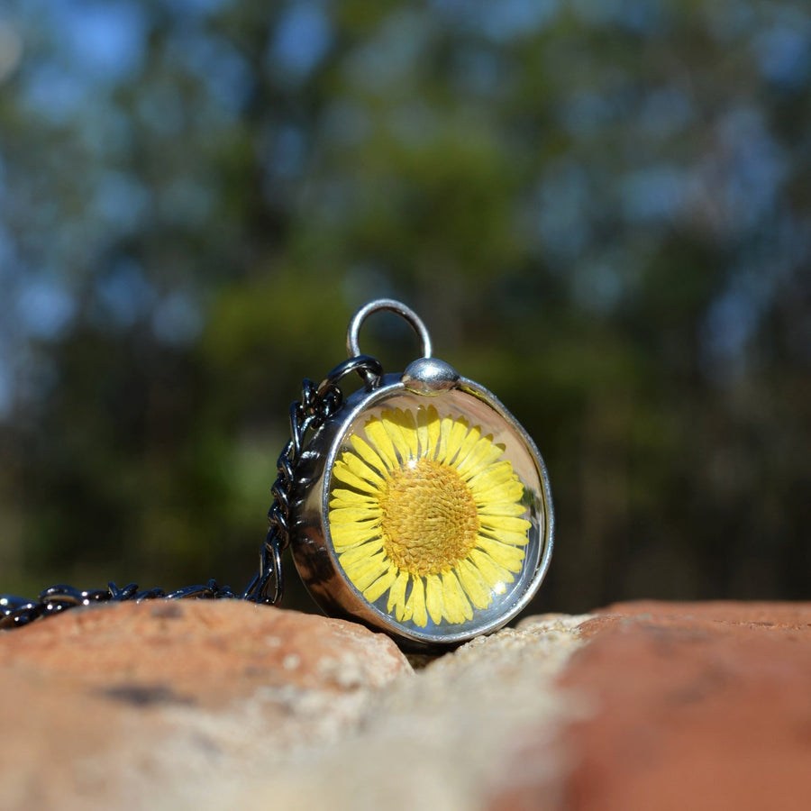 Yellow Aster Pressed Flower Necklace Handmade by Louisiana Artisans at Bayou Glass Arts. 