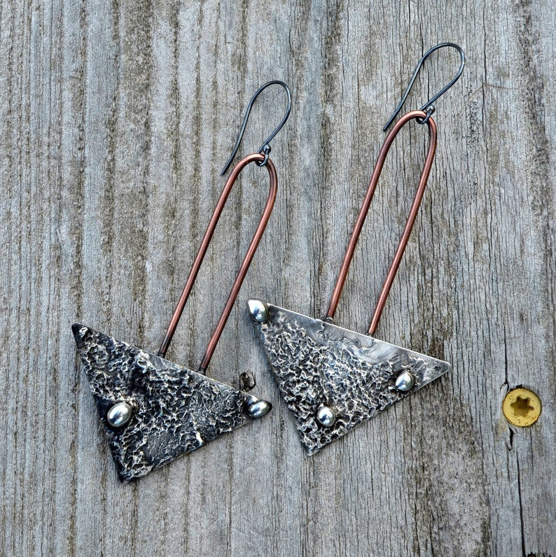 2.5 inch long mixed metal earrings on sterling silver ear wires. Truly Handmade by Louisiana Artisan at Bayou Glass Arts Studio.