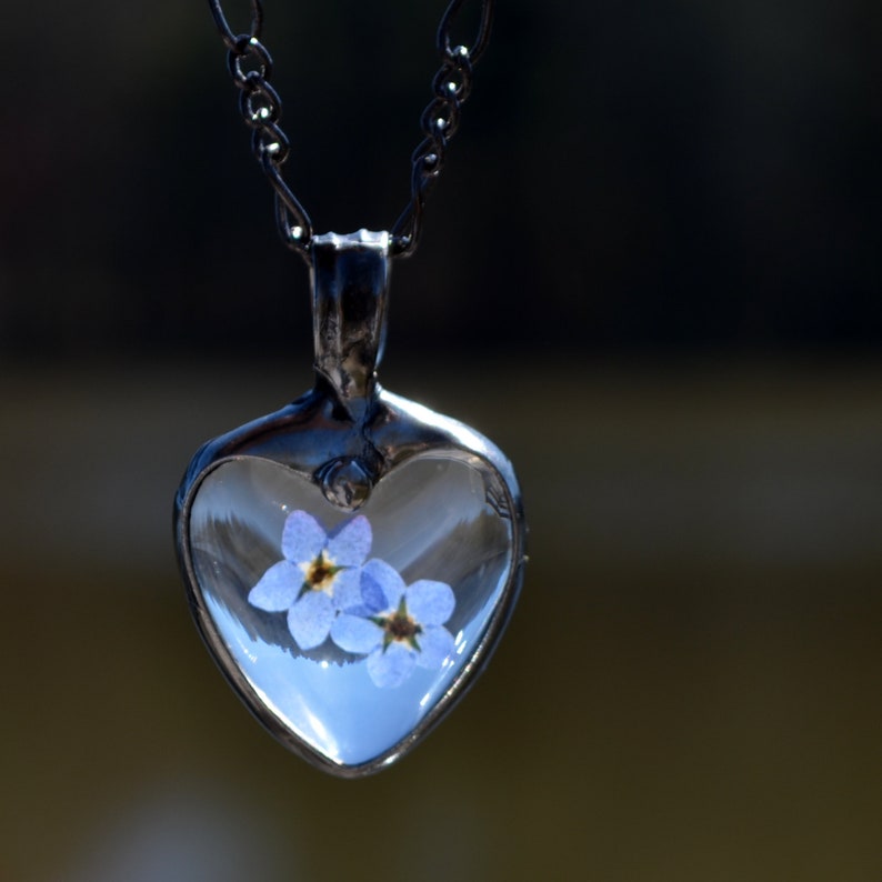 Forget me not heart pendant with 2 blue pressed flower blooms Bezel is hand formed with copper and mixed silver solder by Louisiana Artisan. Hand made in USA. Mother daughter gift for mothers day.