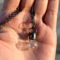 Mustard_Seed_Pendant_in_hand