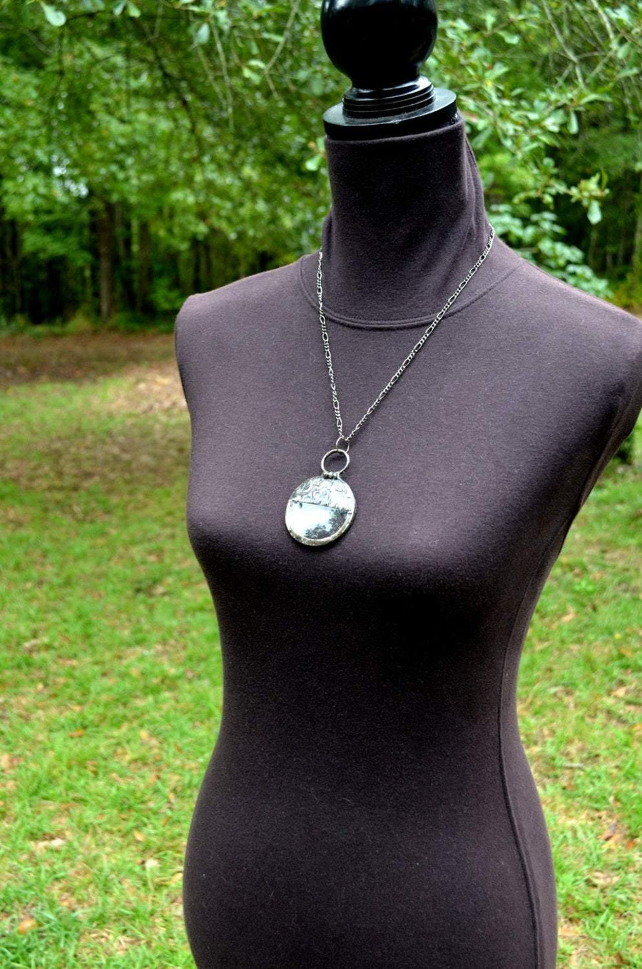 Handmade_Magnifier_Necklace_shown_on_bust_for_length_Bayou_Glass_Arts