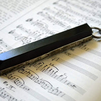 Piano_Key_Necklace_on_Sheet_Music
