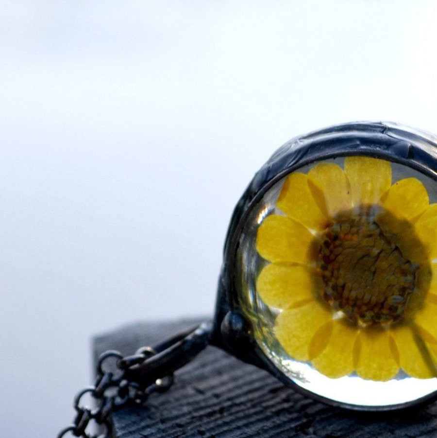 large yellow sunflower pendant dry pressed flower encased in glass necklace handmade by Louisiana Artisans at Bayou Glass Arts