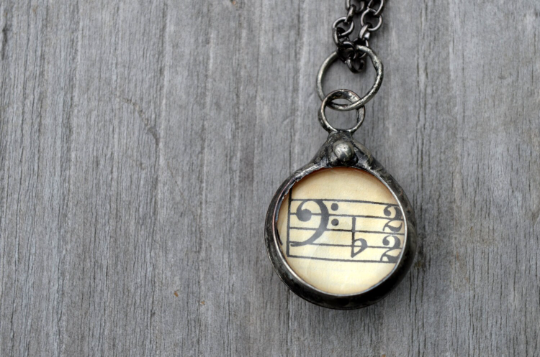 Musical Pendant Necklace - Made from Vintage Sheet Music under glass - Two Sided - Treble Clef on one side and Bass Clef on Reverse - Hand Made in USA by Louisiana Artisan at Bayou Glass Arts studio.
