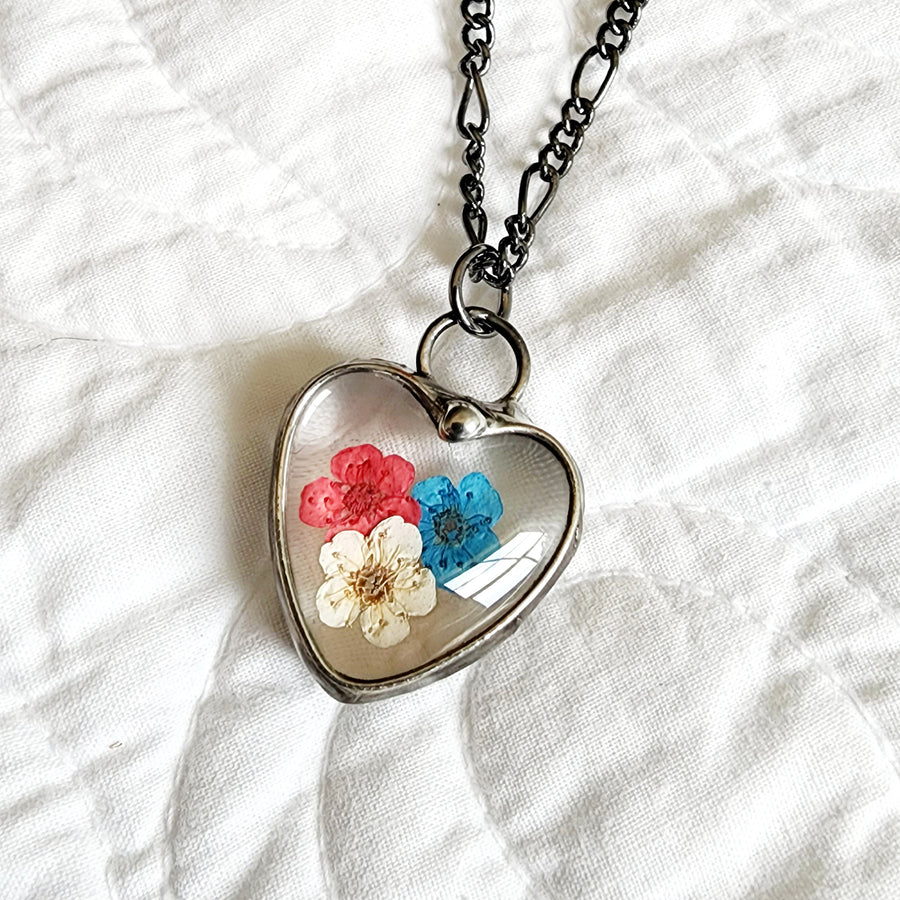 Handmade Red White and Blue Pressed Flower Heart Pendant Necklace. Truly Handmade in USA by Louisiana Artisan at Bayou Glass Arts Studio. Forget Me Nots