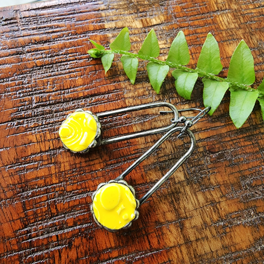 yellow ceramic dot earrings on copper wires, dangle earrings attached to sterling silver ear wires. Truly Hand Made In USA by Louisiana Artisan at Bayou Glass Arts Studio.